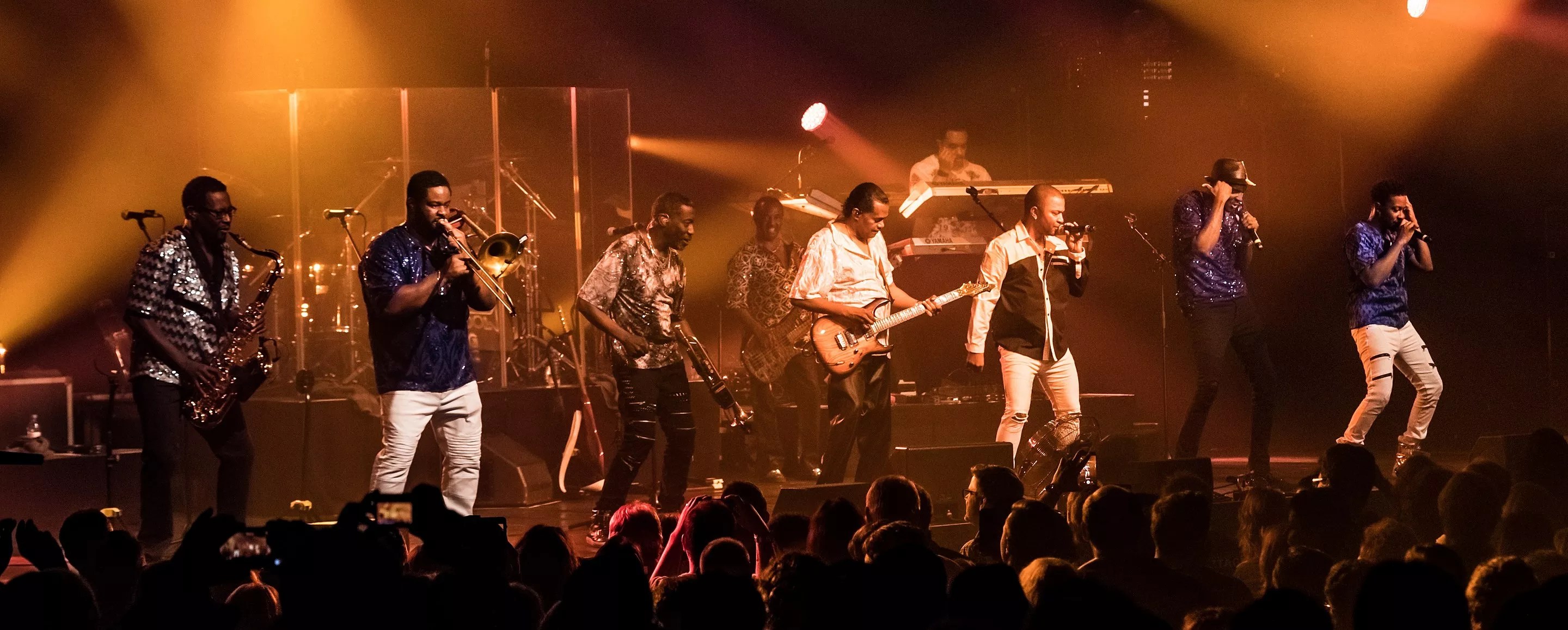 Picture of a band performing on stage.